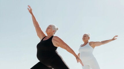 Obraz premium Elderly woman and younger woman practicing yoga together outdoors, embracing wellness and active aging under a bright sky