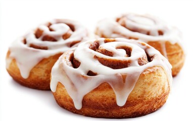 Freshly baked cinnamon rolls with cream cheese icing isolated on white