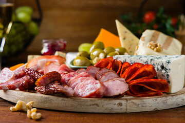 Meat and cheese board. A mix of exquisite cheeses and cold cuts from many countries.