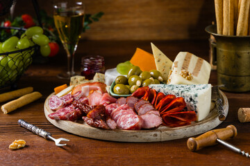 Meat and cheese board. A mix of exquisite cheeses and cold cuts from many countries.