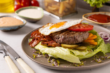 Beef burger without a bun with a fried egg