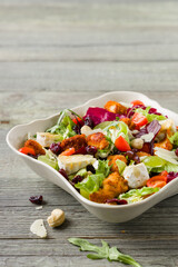 Traditional spring Italian salad with breaded chicken, camembert cheese, grapes and nuts. Served with croutons.