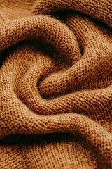 Fototapeta premium Cozy brown knit fabric texture, perfect for warm backgrounds and textile designs