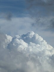 Fluffy white clouds in the blue sky