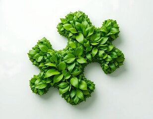A green puzzle piece icon formed by lush leaves against a white background. Depicts solution, connection, and nature. Ideal for eco-friendly, problem-solving, or design projects.