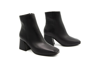 Fashionable classic leather boots on heels isolated on white background. View from all sides.	