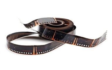 Vintage film strip laying on a surface with an artistic twist showcasing its unique textures and characteristics