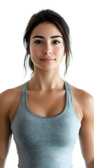 Fototapeta premium Confident Fit Woman Standing With a Natural Smile Against a Bright Background in a Fitness Concept Portrait