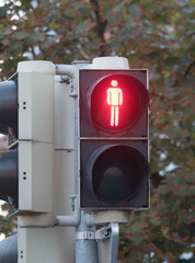 red pedestrian traffic light on the street