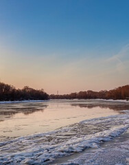 Calm river with a beautiful blue sky in the background