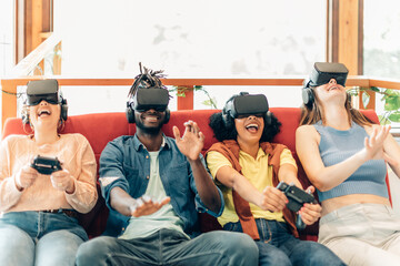 Diverse friends enjoying virtual reality gaming session