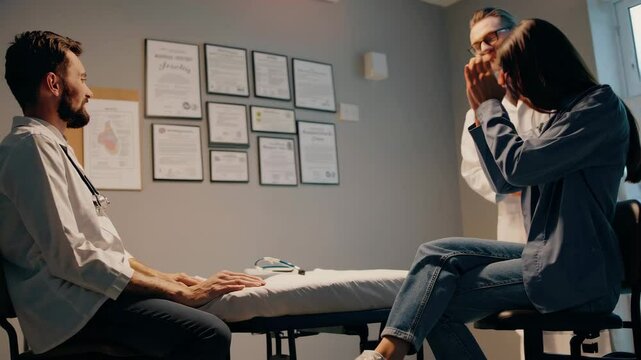 Doctor and patient talking with a smile.