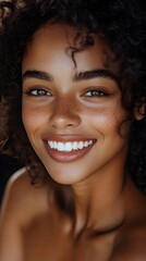 Beautiful ethnic woman with curly hair showcasing fresh glowing skin and radiant smile in natural light
