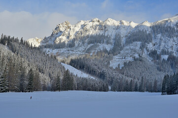 Winter panorama mountain landscape after sunrise, icy temperatures and fresh snow fall, seen during a ski tour in the popular Kaiserau, Admont, Styria, Austria