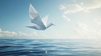 Origami white dove flying into the sky from water. Symbol of world peace, human rights, and hope.