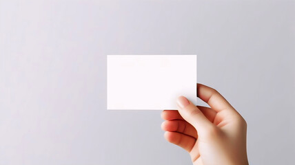 A Hand Holding a White Business Card, Blank Card for Branding and Identity