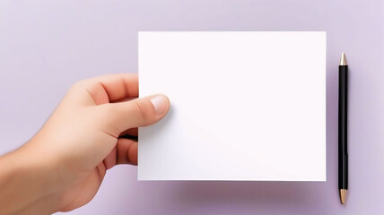 Obraz premium Hand Holding White Paper, Blank Paper for Writing, Empty Sheet in Hand