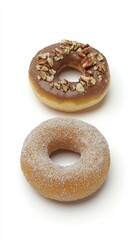 Three delicious donuts chocolate cream sugared and nut topped