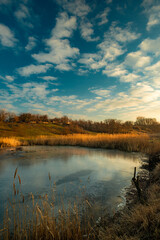 Beautiful nature on the lake ,sunrise from the hills, landscape photoshoot of beautiful red and orange sunrise , sky and clouds , reflections on water . Breathtaking sunrise , place of silence 