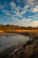Beautiful nature on the lake ,sunrise from the hills, landscape photoshoot of beautiful red and orange sunrise , sky and clouds , reflections on water . Breathtaking sunrise , place of silence 