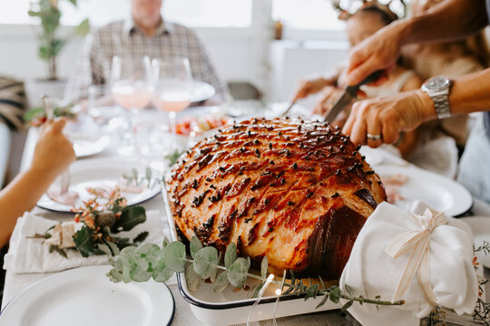Glazed holiday ham with cloves served for dinner