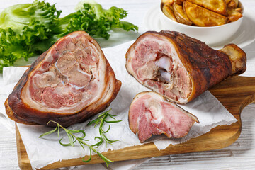 Smoked pork knuckle, ham hock on cutting board