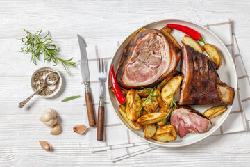 Smoked pork knuckle, ham hock on white plate