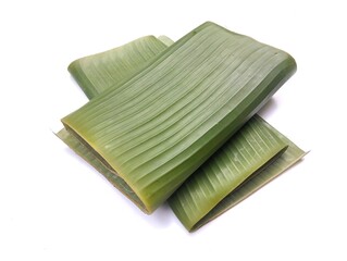 Green banana leaf roll isolated on white background 