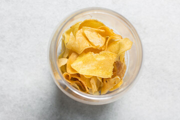Overhead view of golden sweet potato chips, top view of crispy fried sweet potato chips