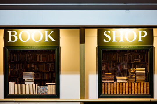 Stack of books inside window of Book Shop
