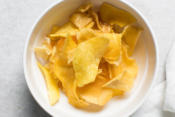 Overhead view of golden sweet potato chips, top view of crispy fried sweet potato chips