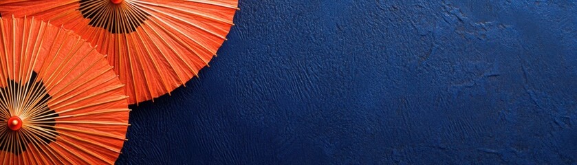 Delicate Wagasa umbrella motifs in bright orange over a navy blue background, airy and traditional