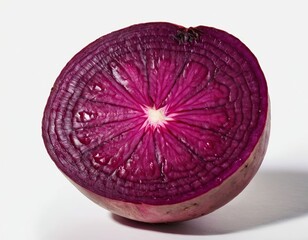 Vibrant purple onion half showcasing intricate textures and rings.