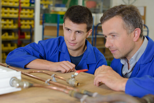 a manager and a apprentice plumbers