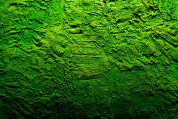 
plaster background in green color with fine texture