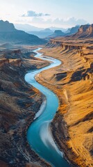 Scenic Aerial View of Serpentine River Flowing Through Arid Desert Valley with Majestic Cliffs and Vibrant Terrain