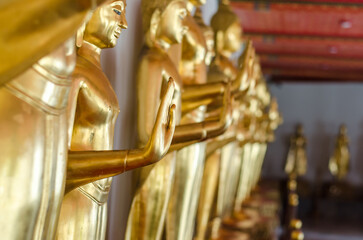 Golden Buddha statues in a serene setting