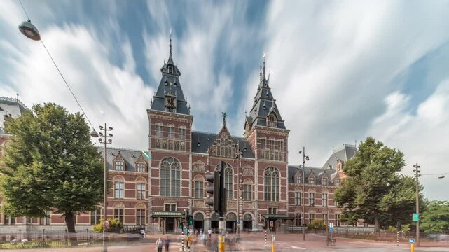 Hyperlapse of the Rijksmuseum, a famous tourist attraction in Museum Square, Amsterdam. The national museum of Netherlands, dedicated to Dutch art and history timelapse. People walking around entrance
