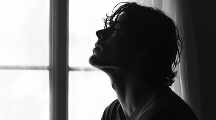 Withdrawal symptoms in a person standing by a window, eyes closed. Featuring emotional exhaustion and physical discomfort