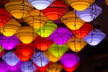 Vibrant Multicolored Hanging Lamps with Festive String Lights