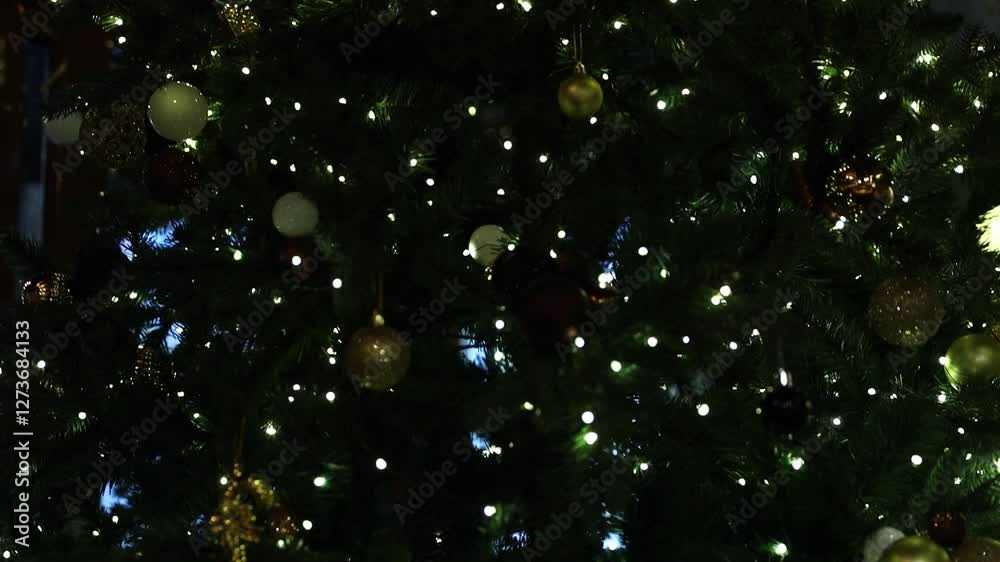 Poster a large christmas tree with a clock in the background, perfect for holiday decorations and events.