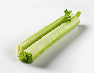 Fresh green celery stalks with vibrant leaves on a clean white background.