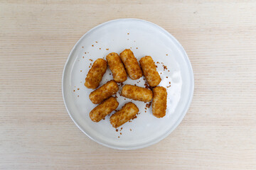 A plate of mini croquettes.