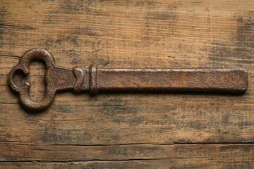 Vintage blank paper on a wooden background with copy space for text or design, top view. Old, yellowed parchment texture.