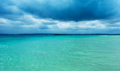 Horizontal view of dramatic overcast sky and sea.