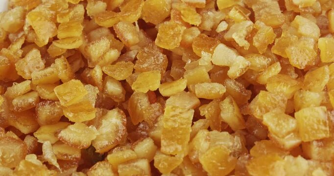 minced candied orange peel closeup rotating selective focus 4k 30fps