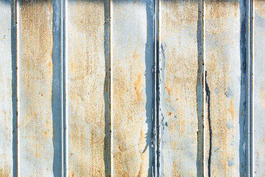 Close-up of old rusty metal barn wall