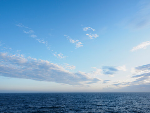 Wispy clouds above sea