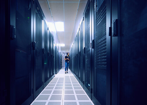 Female technician walking in server room