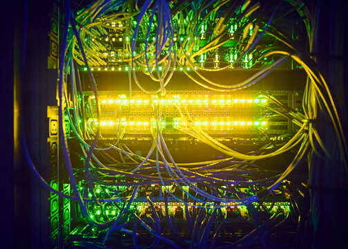 Close-up&nbsp;of hard drives and cables in data center